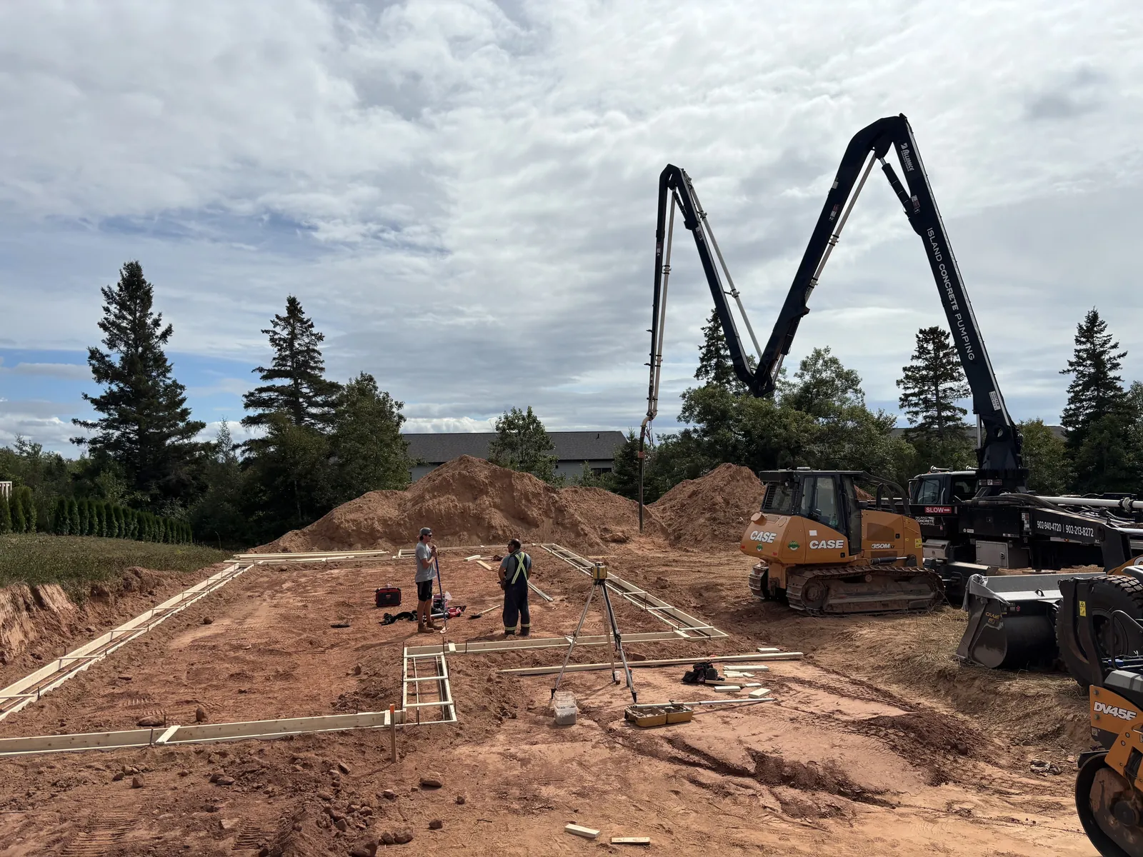 A concrete pump truck placing a foundation on a BernMar site