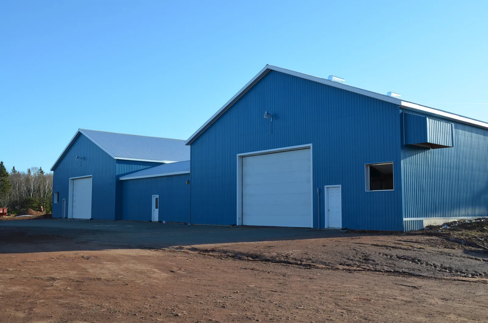 A finished potato storage building clad in blue steel