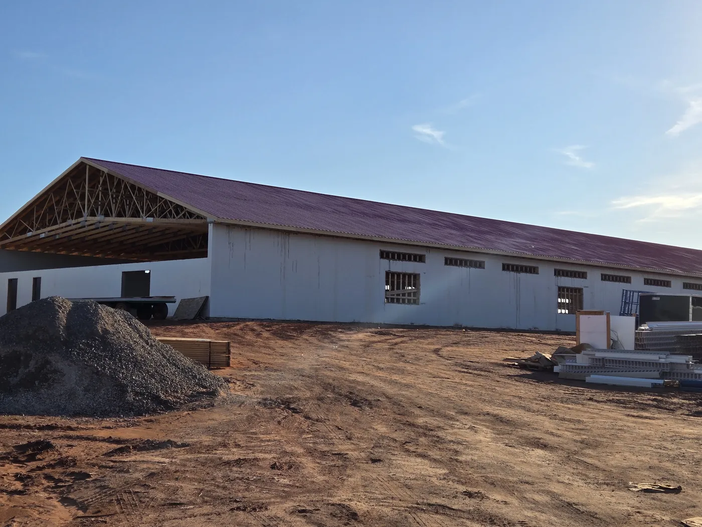The pullet barn under construction with the trusses up